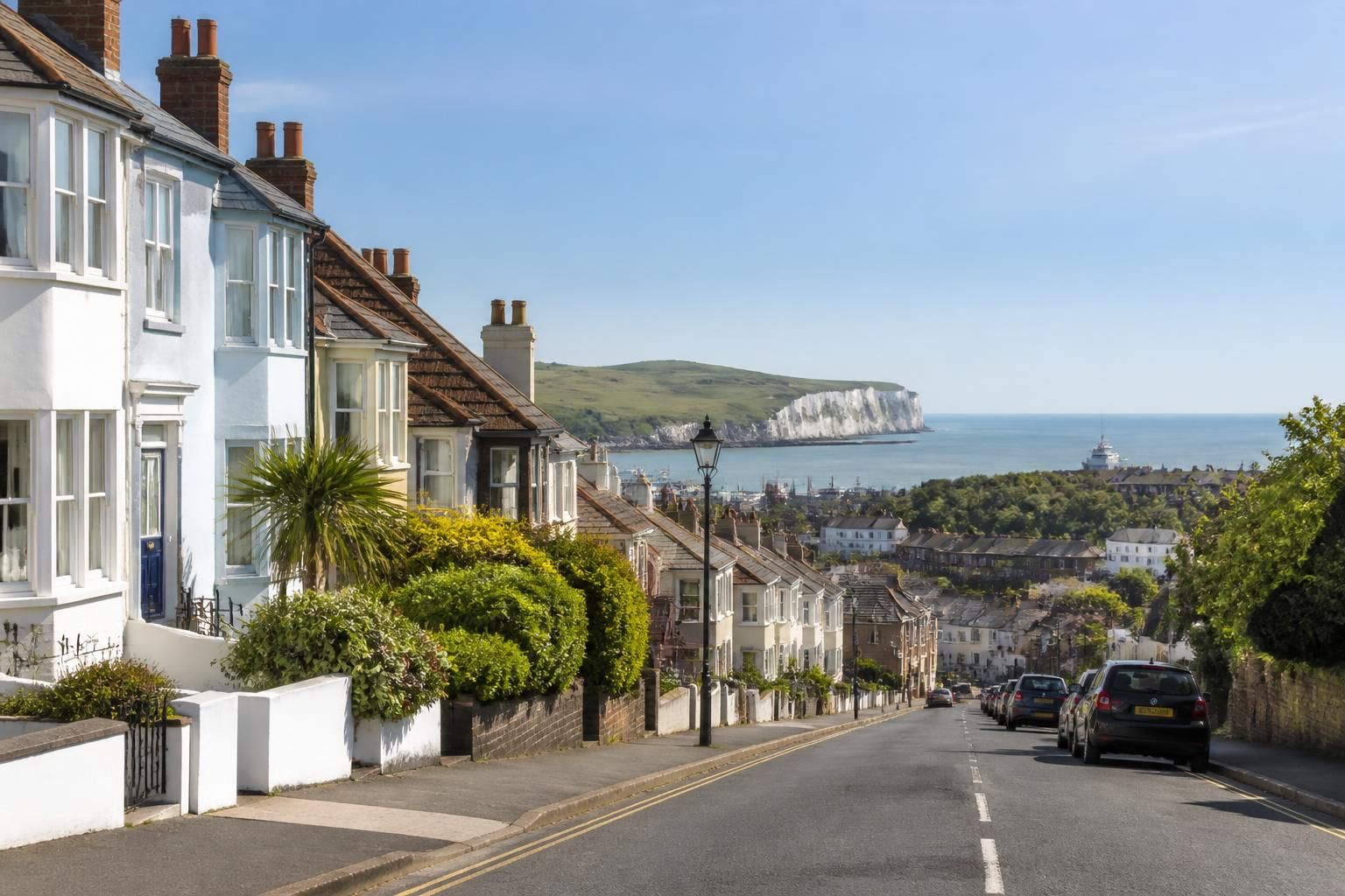 Calm residential street scene with open sky in Dover.